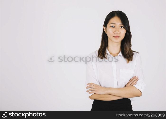 young businesswoman with arms crossed