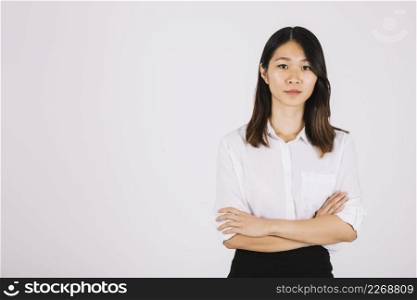 young businesswoman with arms crossed