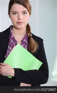 Young businesswoman with file.