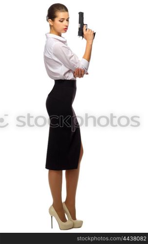 Young businesswoman with gun isolated