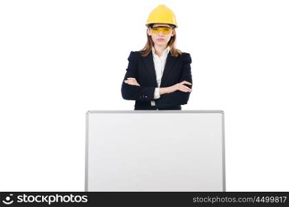 Young businesswoman with hard hat and blank board isolated on white