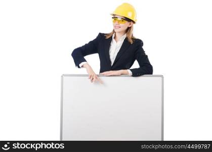Young businesswoman with hard hat with blank board isolated on white