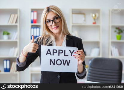 Young businesswoman with message in the office