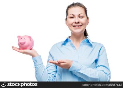young businesswoman with piggy bank on palm on white background isolated
