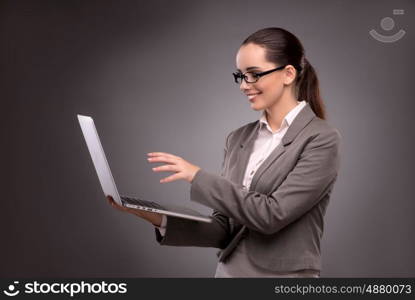 Young businesswoman working with laptop in business concept