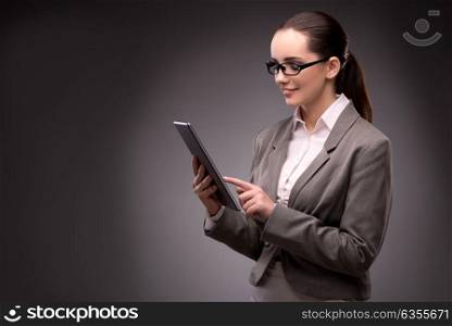 Young businesswoman working with tablet computer