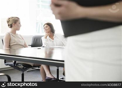 Young businesswomen meeting in conference room
