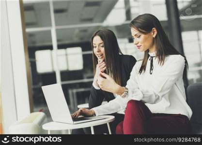 Young businesswomen working on laptop in the office
