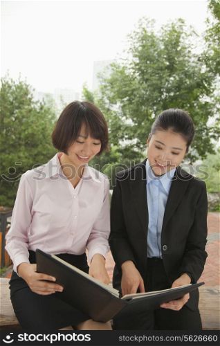 Young businesswomen working outdoors