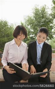 Young businesswomen working outdoors