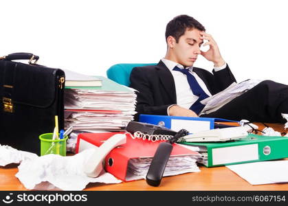 Young busy businessman at his desk