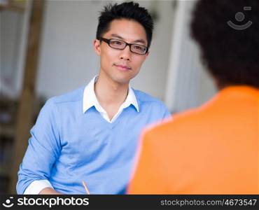 Young candidate having an interview with his employer. I am ready to answer your questions