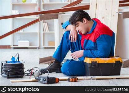 Young carpenter at work tired feeling not well