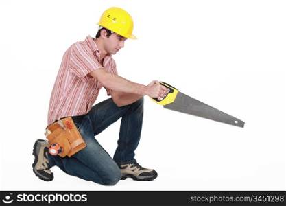 young carpenter in profile stretching saw