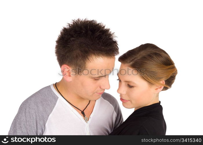 Young casual attractive couple in romantic mood sharing a tender moment isolated on white background