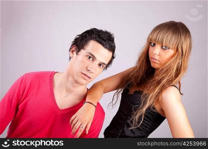 Young casual couple posing isolated