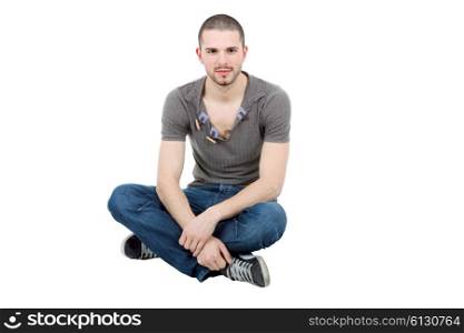 young casual happy man seated on studio, isolated