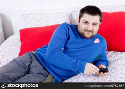 young casual happy silly man in bed
