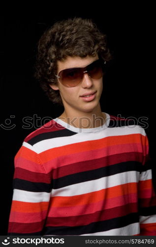 young casual man against a black background