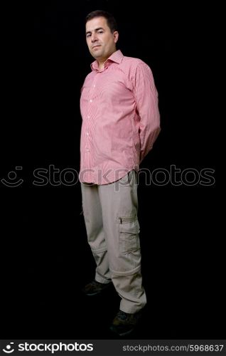 young casual man full body on a black background