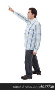 young casual man full body pointing in a white background