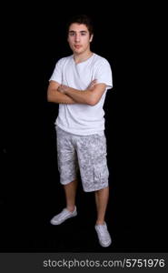 young casual man full length, on a black background
