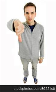 young casual man going thumb down in a white background