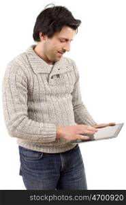 young casual man looking to his tablet pc, isolated