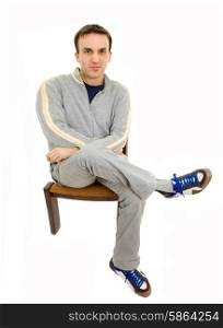 young casual man on a chair, isolated on white