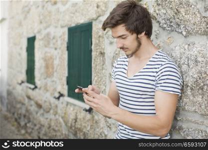 young casual man on the phone, outdoor