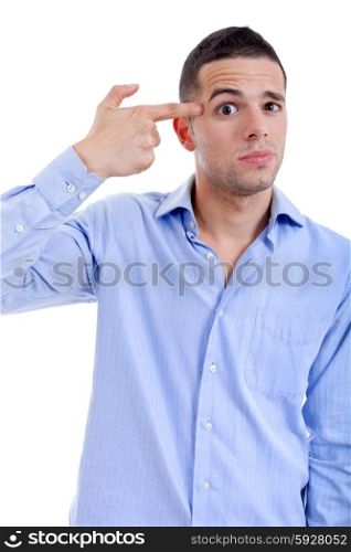 young casual man pointing to his head, isolated