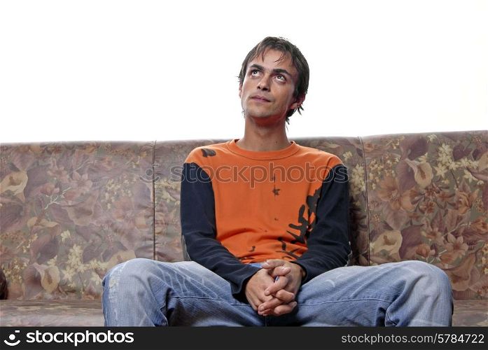 young casual man portrait in a sofa