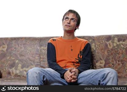 young casual man portrait in a sofa