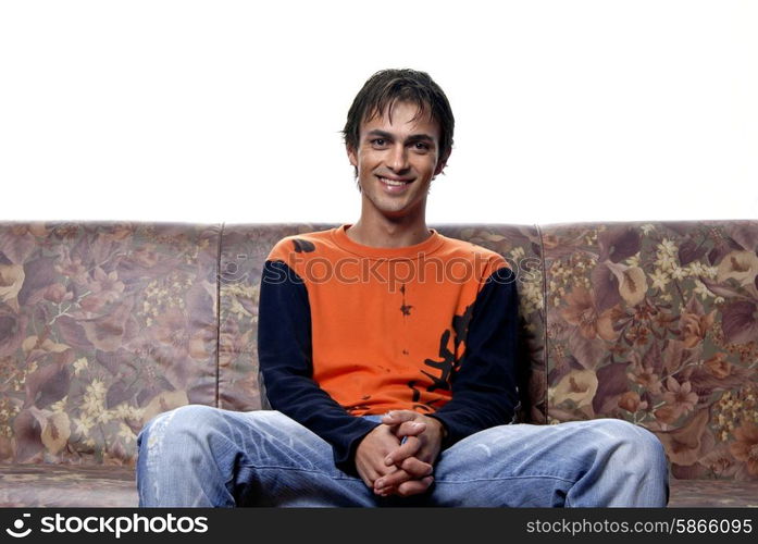 young casual man portrait in a sofa