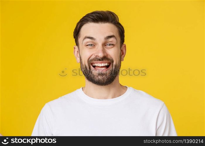 Young casual man portrait isolated on yellow background.. Young casual man portrait isolated on yellow background