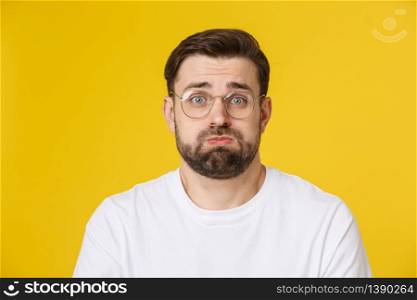 Young casual man portrait isolated on yellow background.. Young casual man portrait isolated on yellow background