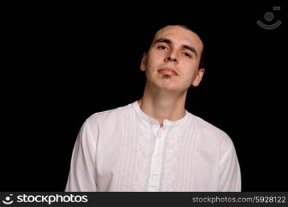 young casual man portrait, on a black background