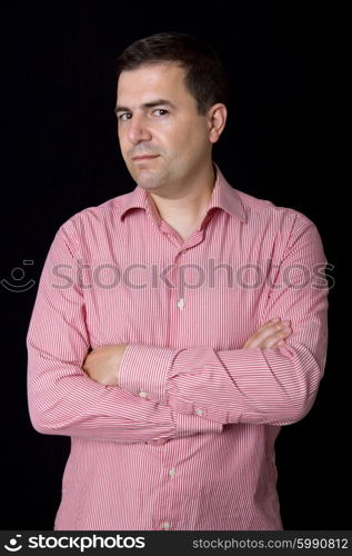 young casual man portrait on a black background