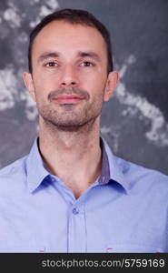 young casual man portrait on a dark background