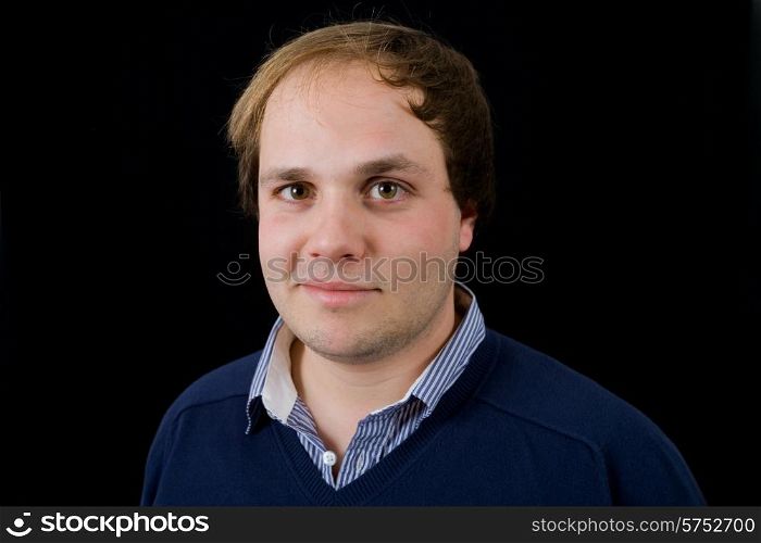 young casual man portrait on black background