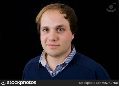 young casual man portrait on black background