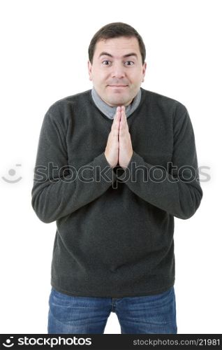 young casual man praying, isolated on white