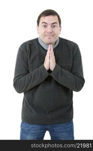 young casual man praying, isolated on white