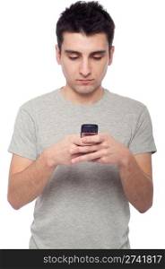 young casual man sending a text message isolated on white background