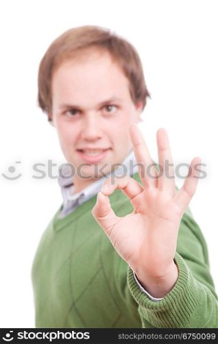 Young casual man signaling Ok - focus on hand