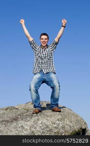 young casual man with the sky as background