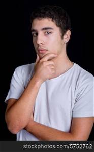 young casual pensive man on a black background