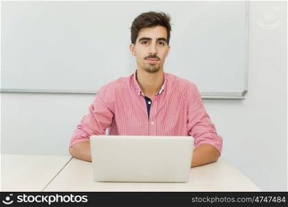 young casual teenager student in the classroom
