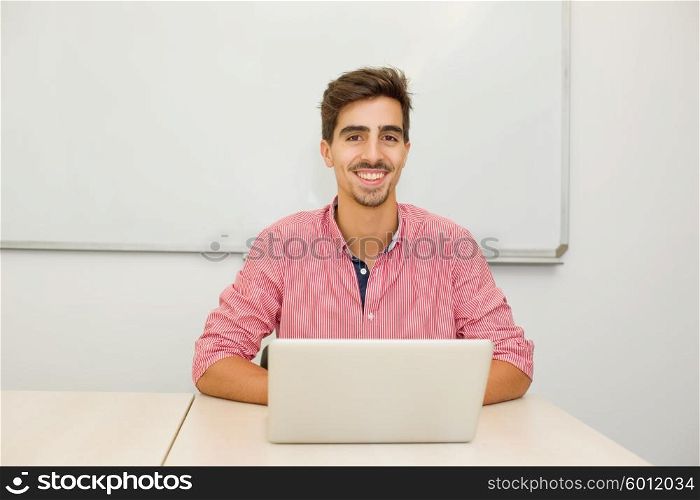 young casual teenager student in the classroom