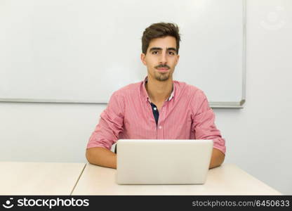 young casual teenager student in the classroom